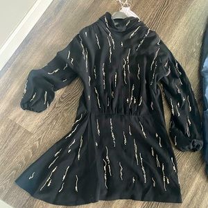 I’m selling my Prada dress with crystals on it.